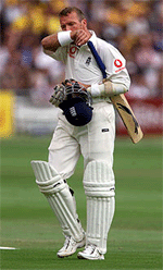 England's batsman Alec Stewart leaves the field after being dismissed by Australia's Glenn McGrath during the fourth day's play of the second Ashes test at Lord's on Sunday.