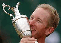 David Duval smiles as he holds the trophy after winning the British Open Golf Championship at Royal Lytham and St. Annes Golf Course in England on Sunday. 