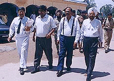 Former DGP, Haryana, Mr S.P.S. Rathore, (2nd from right), outside the court of Special Magistrate for CBI cases in Haryana.