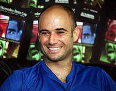 Andre Agassi speaks at a news conference during the Mercedes Benz Cup tennis tournament in Los Angeles on Monday. Agassi revealed that he and Steffi Graf will be parents of a baby boy in December.