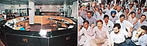 Telephone Exchange in Sector 34 wears a deserted look on account of a nationwide strike by telecom employees; and (right) a section of telecom employees hold protest in support of their demands in Chandigarh on Wednesday. 