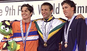 Ian Thorpe (C) of Australia wears his gold medal for the men's 200 metre freestyle final with silver-winner Pieter van den Hoogenband (L) of the Netherlands and bronze-winner Klete Keller of the United States at the ninth World Swimming Championships in Fukuoka on Wednesday.