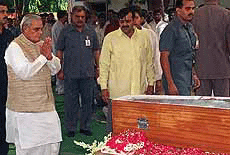 Prime Minister A.B. Vajpayee paying his last respect to the late Phoolan Devi at her residence in New Delhi on Thursday.