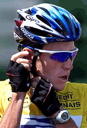 US Postal Service team rider Lance Armstrong of the USA speaks into a microphone at the start of the 17th stage of the Tour de France cycling race