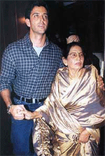 Bollywood superstar Hrithik Roshan arrives with his grandmother Ira Roshan (R) for the launch of a music cassette in Bombay on Friday.