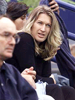 Steffi Graf watches Andre Agassi play Greg Rusedski during the Mercedes-Benz Cup in Los Angeles on Thursday.