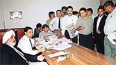 The District and Sessions Judge, Mr H.S. Bhalla, settles cases in a special Lok Adalat .
