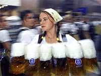 A beer maiden carries beer-mugs during the opening ceremony of the Oktoberfest in Munich in this September 16, 2000 file photo. 