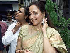Hema Malini poses for photographers after inaugurating the shooting of a Bengali movie in Kolkata on Monday.