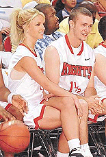 Singer Britney Spears and her boyfriend, Justine Timberlake of "NSync," sit on the bench together during player introductions prior to the celebrity basketball game at the pop bands "Challenge for the Children III" event at the Thomas & Mack Centre in Las Vegas on Sunday. 