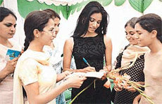 Annie Thomas, a former Femina Miss India-World, signs autographs after inaugurating the School of Art and Fashion Technology in Sector 44, Chandigarh, on Tuesday.