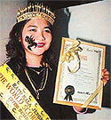 Malaysias scorpion queen Nor Malena Hassan shows the Malaysian Book of Records certificate .