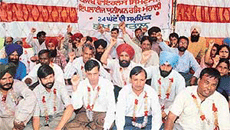 Members of the Punjab Wireless System Employees Union on a fast at Balongi Chowk, SAS Nagar, on Wednesday.