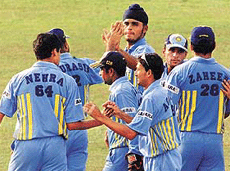 Indian teammates celebrate as the last Sri Lankan wicket falls during their one-day match in Colombo on Wednesday. India won the match by 46 runs. 