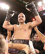 Tony Ayala Jr., of San Antonio, is raised into the air after he was declared the winner of his 10-round bout with two-time world champion Santos Cardona, a Santurce, Puerto Rico, in San Antonio, on Tuesday. 