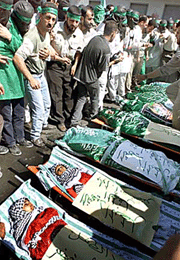 The bodies of slain Palestinians who were killed in an Israeli attack are displayed before their funeral in the West Bank town of Nablus on Wednesday. 
