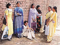Candidates for the posts of government teacher stand in scorching heat as they wait for their turn at Government Senior Secondary School, Bharat Nagar, Ludhiana, on Thursday.