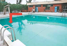 The arrow shows the area where the body of Karanbir Singh was found at the bottom of the swimming pool
