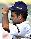 Virender Sehwag adjusts his cap during a training session in Colombo on Saturday.