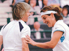 Martina Natratilova and Arantxa Sanchez Vicario, share a light moment at Wimbledon.