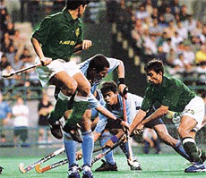 Indias Dilip Tirkey (second from left) and teammate Bimal Lakra (second from right) fight for a loose ball.