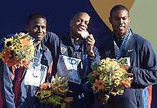 Maurice Greene (C), Tim Montgomery (L) and Bernard Williams all of the USA pose with their medals after the men's 100 metres final at the World Championships in Athletics, in Edmonton on Sunday.