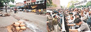 Traders symbolically try to do away with a road barrier near the grain market and (right) a deserted grain market owing to a protest lodged by traders against the setting up of road barriers.
