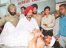 Mr Vijaypal Singh Dimpy lies injured at the General Hospital, Sector 16, after he was bashed up in Sector 36-D in Chandigarh on Tuesday.