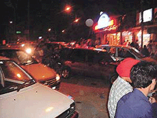 Vehicles of roadside diners block the Malhar Cinema road of Ludhiana.