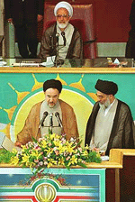 Iranian President Mohammad Khatami takes the oath of office in the presence of hardline judiciary chief Ayatollah Mahmood Hashemi Shahroudi (right) and Majlis Speaker Mehdi Karroubi (top) in Teheran on Wednesday