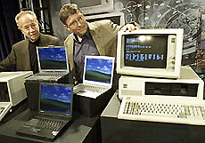 Bill Gates (R), chairman and chief software architect of Microsoft, poses for photographers with Andy Grove, chairman of Intel Corporation, at the Tech Museum of Innovation in San Jose, California on Wednesday. 