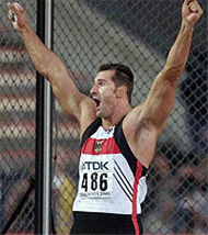 Lars Riedel of Germany celebrates a throw in the discus competition.