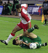 Georgios Kargounis of FC Panathinaikos Athens is tackled by Slavia Prague's Jlri Skala.