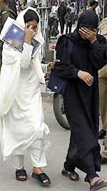 Girls shy away from camera following renewed threats to women moving without burqas in Srinagar streets. 