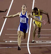 Greeces Konstadinos Kederis finishes first ahead of Jamaicas Christopher Williams in the 200m mens final 