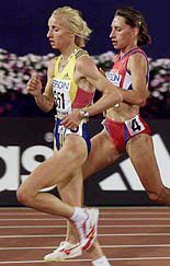 Olga Yegorova (R) of Russia and Gabriela Szabo of Romania race side by side during the womens 5,000m qualifier at the world championships 