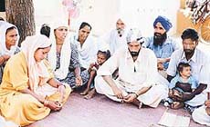 Villagers mourn the death of two-year-old Gogi, who was devoured by dogs on Friday.