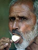 A man eats an ice-candy