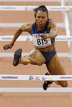Gail Devers of the USA leaps over a hurdle during a women's 100m hurdle semifinal.