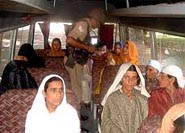 A BSF jawan searching a private passenger bus.