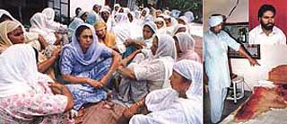 Grieving members of the family of Buta Singh.