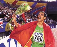 Morocco's Hicham EI Guerrouj during his victory lap after winning the men's 1500m at the World Track and Field Championships in Edmonton, Canada on Sunday.