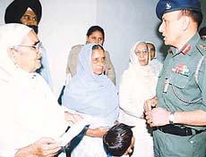 War widows interact with Col N.S. Rawat at a function in the Western Command headquarters, Chandi Mandir, on Tuesday.