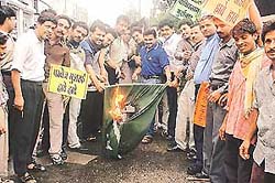 Activists of the youth wing of the All-India Anti-Terrorist Front setting a Pakistani flag on fire on the occasion of Pakistans Independence Day in Ludhiana on Tuesday.