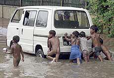 Children push a van