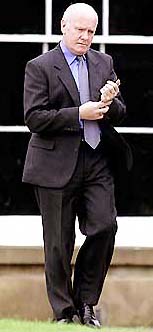Northern Ireland Secretary of State Dr John Reid walks to a news conference at Hillsborough Castle on Tuesday.