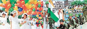 Schoolgirls release balloons to mark the Independence Day celebrations in Chandigarh on Wednesday and (right) a play on the Indo-Pak peace process being staged by schoolchildren