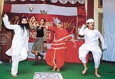 Students of Gupta Model High School present a choreography as a part of Independence Day 