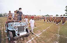 Chief Minister Parkash Singh Badal, flanked by DGP Sarabjit Singh, inspects the parade.