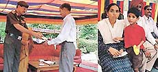 The Commanding Officer, Col G.R. Titerwal, gives grants to kin of martyrs. 